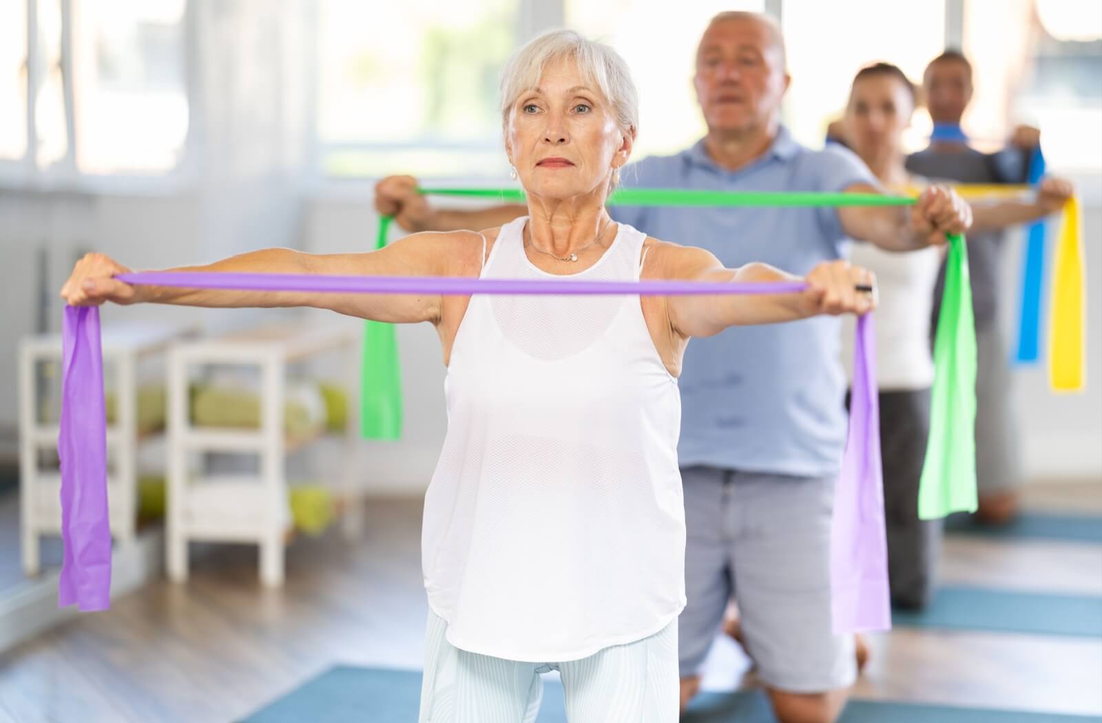 A group of seniors participating in a group fitness class as a means of preserving their overall health and memory